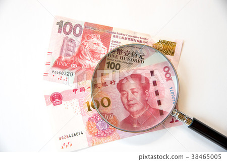 Chinese and Hong Kong banknotes and magnifying glass 38465005