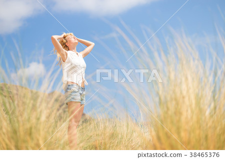 Free Happy Woman Enjoying Sun on Vacations. Free Happy Woman Enjoying Sun on Vacations. 38465376