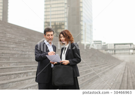 male lawyer speaking with female client. male lawyer speaking with female client. 38466963