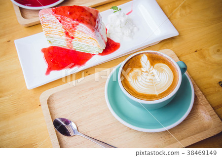 coffee red cup cappuccino and cake on table 38469149