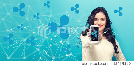 Ripple with young woman holding out a smartphone 38469390