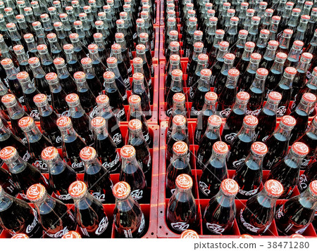 Many coke or coca-cola bottle in a plastic crates  38471280
