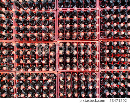 Many coke or coca-cola bottle in a plastic crates Many coke or coca-cola bottle in a plastic crates 38471292