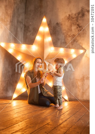 Young Mother and her Child Boy on Studio  38472891