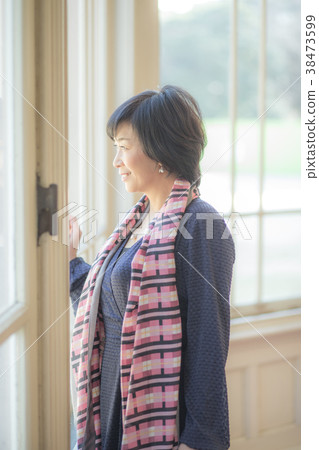 Woman at the window Woman at the window 38473599