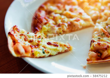 Tortilla Pizza with mozzarella cheese and corn. Tortilla Pizza with mozzarella cheese and corn. 38475212