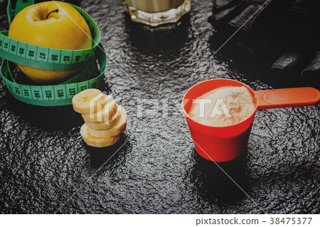 Protein powder in scoop Protein powder in scoop 38475377