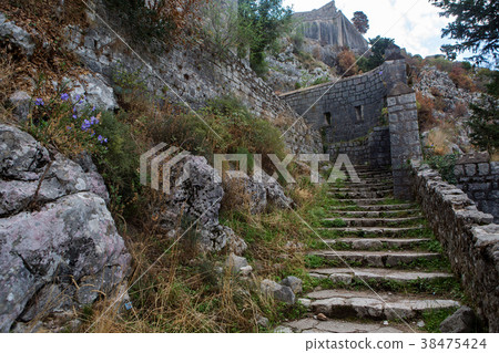 narrow stone road to the fortress wall narrow stone road to the fortress wall 38475424
