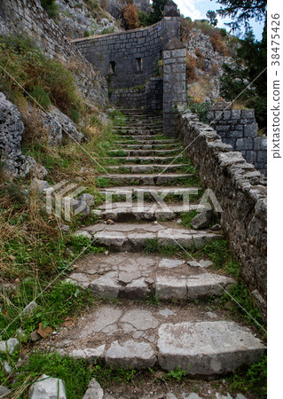 narrow stone road to the fortress wall 38475426