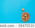 Spotted quail eggs in a straw nest  38475510