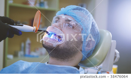 Doctor and patient with retractor in the dental Doctor and patient with retractor in the dental 38476064