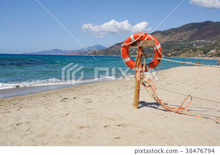 Life preserver on sandy beach somewhere near at 38476794