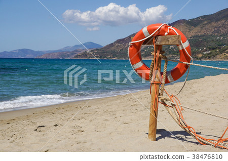 Life preserver on sandy beach somewhere near at 38476810