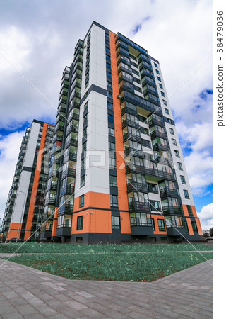 New high-rise house on a background of blue sky New high-rise house on a background of blue sky 38479036