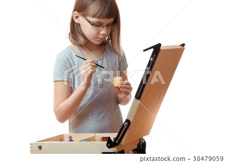 Girl teenager painting on an easel isolated on Girl teenager painting on an easel isolated on 38479059