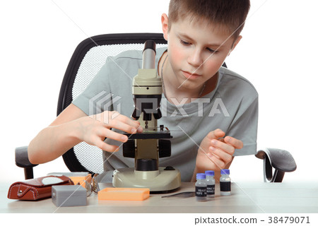 Teen boy in school laboratory. Researcher working 38479071