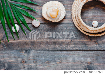 Brown wooden background with beach attributes 38480769