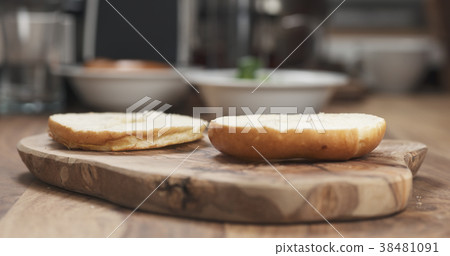 sliced bagel on wood board sliced bagel on wood board 38481091