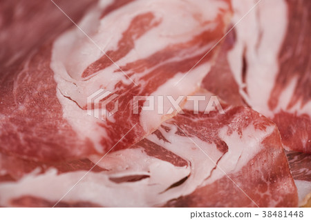 closeup cured italian coppa on olive wood board closeup cured italian coppa on olive wood board 38481448