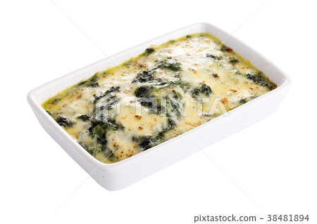 Baked spinach with cheese isolated on background Baked spinach with cheese isolated on background 38481894