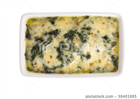 Baked spinach with cheese isolated on background Baked spinach with cheese isolated on background 38481895