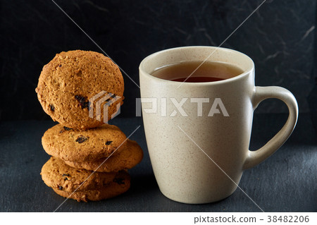 Close-up white cup of coffee with chocolate chip Close-up white cup of coffee with chocolate chip 38482206