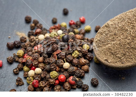 Top view of a wooden spoon full of grind black Top view of a wooden spoon full of grind black 38482230