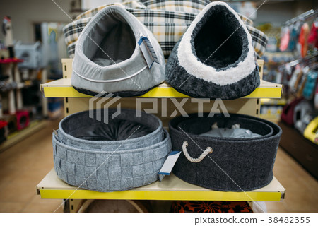 Inside pet shop, shelves with accessories, nobody Inside pet shop, shelves with accessories, nobody 38482355