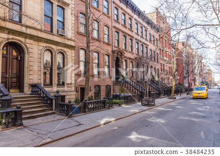 Scenic tree lined street of historic brownstone Scenic tree lined street of historic brownstone 38484235