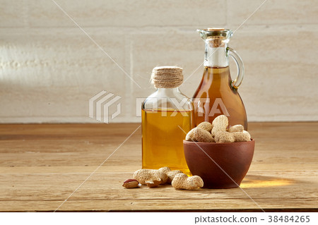 Aromatic oil in a glass jar and bottle with 38484265
