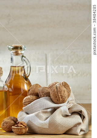 Aromatic oil in a glass jar and bottle with Aromatic oil in a glass jar and bottle with 38484285