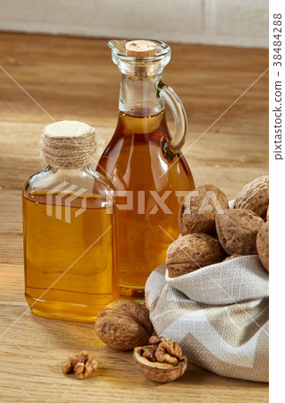 Aromatic oil in a glass jar and bottle with Aromatic oil in a glass jar and bottle with 38484288