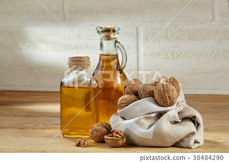 Aromatic oil in a glass jar and bottle with Aromatic oil in a glass jar and bottle with 38484290