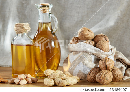 Conceptual composition of glass oil jars with Conceptual composition of glass oil jars with 38484407