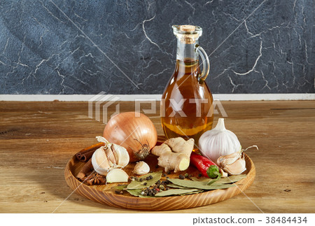 Conceptual composition of different spices and oil 38484434