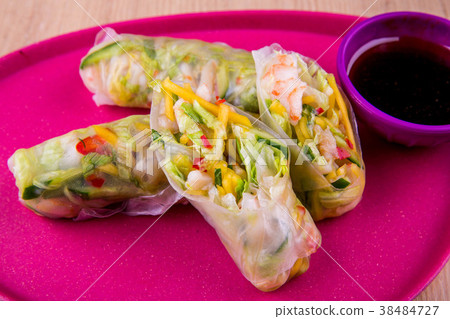 Rolls vegetable with seafood, wrapped in cabbage l 38484727