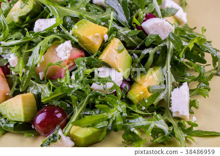 Mango, grapes, cheese of a fetaks with arugula, sa 38486959