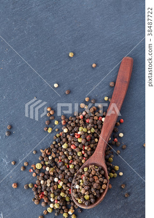Top view on composition of peppercorns in wooden 38487722