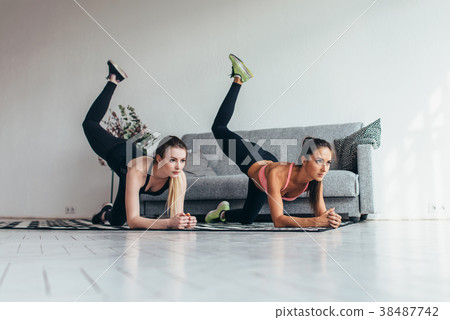 Two sportive female friends doing butt toning 38487742