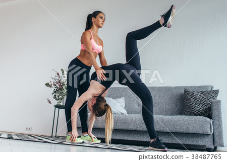Fitness woman doing advanced bridge pose called Fitness woman doing advanced bridge pose called 38487765