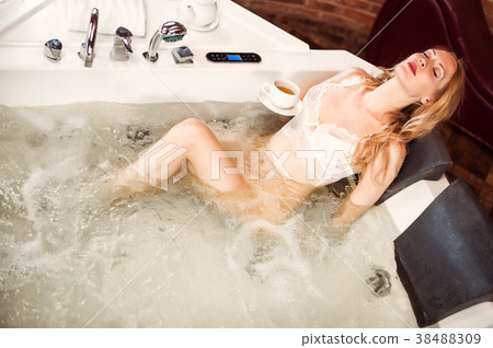 Beautiful woman in jacuzzi in the spa Beautiful woman in jacuzzi in the spa 38488309
