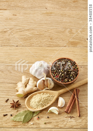 Composition of powder spices on spoon and 38488558