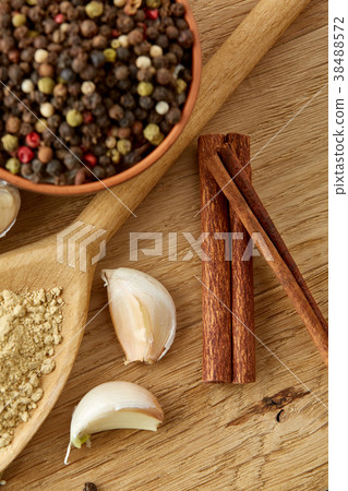 Composition of powder spices on spoon and Composition of powder spices on spoon and 38488572