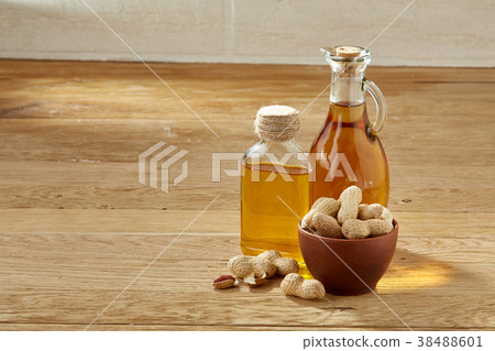 Aromatic oil in a glass jar and bottle with Aromatic oil in a glass jar and bottle with 38488601