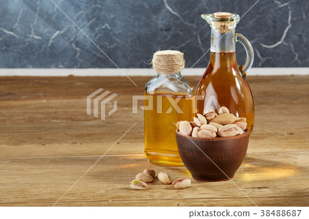 Aromatic oil in a glass jar and bottle with Aromatic oil in a glass jar and bottle with 38488687