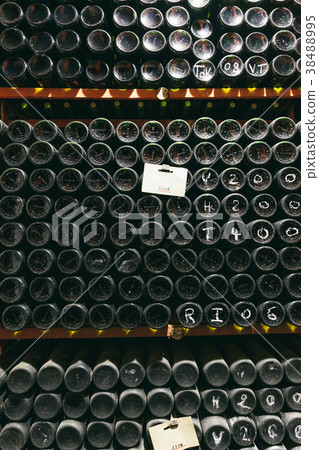 Bottles with wine in the wine cellar Bottles with wine in the wine cellar 38488995