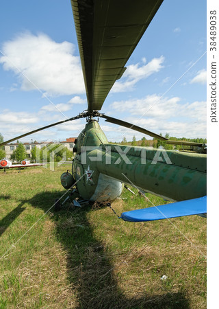 Old Mi-2 helicopter on grass. Yalutorovsk. Russia Old Mi-2 helicopter on grass. Yalutorovsk. Russia 38489038