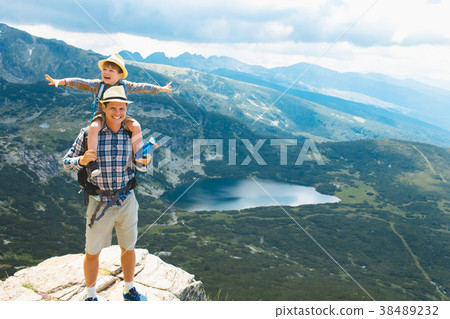 Father and son traveling in Rila mountains Father and son traveling in Rila mountains 38489232