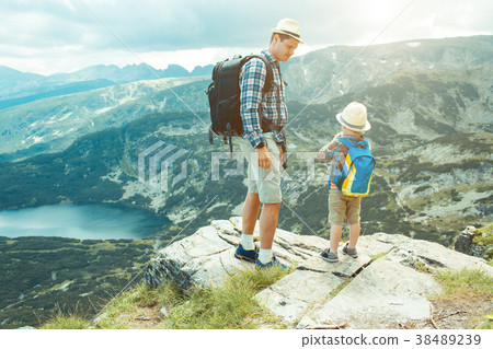 Father and son traveling in Rila mountains Father and son traveling in Rila mountains 38489239