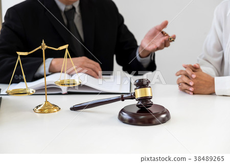 Close up of gavel, Male lawyer or judge Consult with client and 38489265